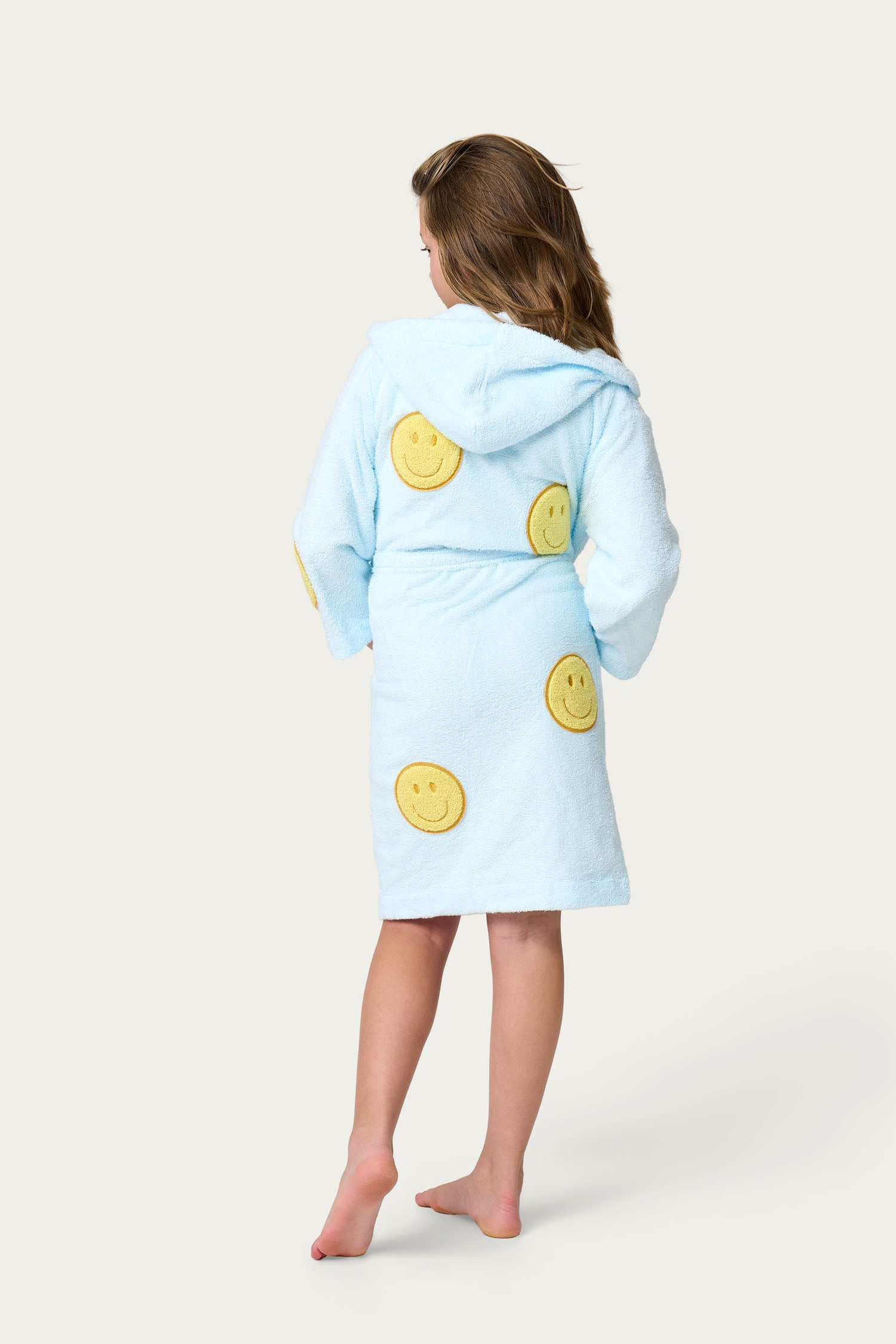 Light blue bathrobe with yellow smiley face patches. Kids bathrobe 
